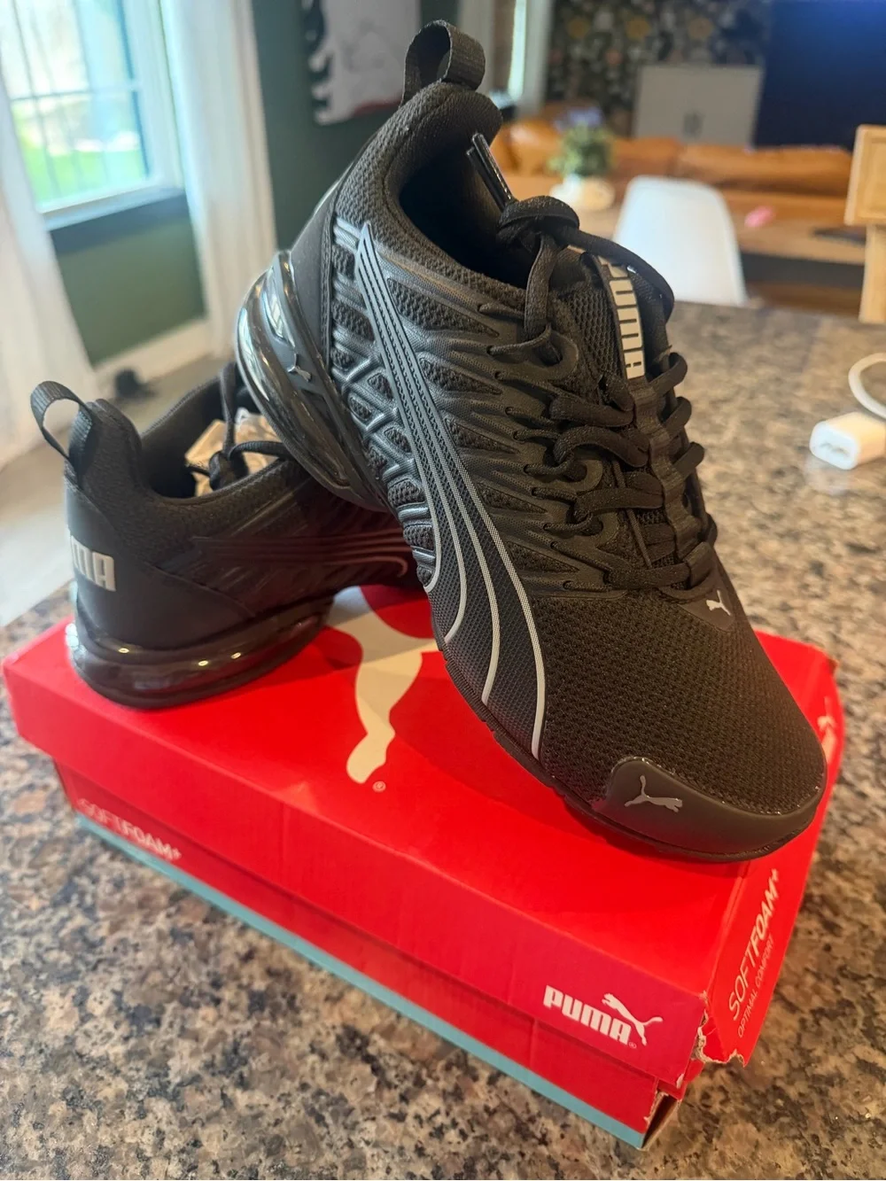 Puma Kids Black Sneaker with Silver Stripe Accents